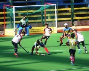 BPCL defender and captain William Xalco stops Punjab Police attacker Ajay Kumar from advancing towards his goal during their Pool-A league match of the 13th PMC Bank-Guru Tegh Bahadur Gold Cup All India Hockey Tournament.