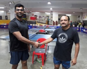 Pankaj Rahane( left) is greeted by Shekhar Kale after their finals.