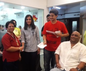 Preeti Pardeshi being greeted by Former Badminton International Aparna Popat while Arwind Prabhu Programme Director PTKS looks on. 