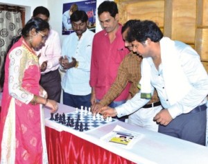 A trainee (left) plays a game with Andhra Pradesh Chess Association officials and Durga Nagesh Guttula, the CEO of SMCA at the launch of the academy in the cities of Eluru and Rajahmundry in Andhra Pradesh.