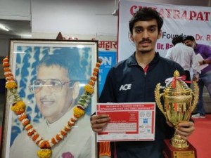 Deepit Patil poses with his Champions trophy and certificates