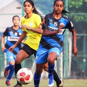 An India Rush player (No.15) is chased by a Footie First attacker during their WIFA Women’s Football League .