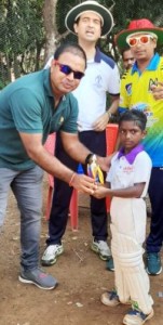 Tiny Atharav Talavalkar, receiving his Man-of-the-match award from MCC  Direector Jwala Singh after the opening tie in the MCC  8-Team  boys under-10 T20 cricket league. 