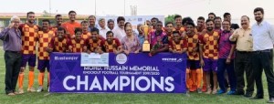 The victorious Reserve Bank of India players are seen in a jubilant mood as they pose with the Mohammed Hussain Trophy of the Rustomjee-MDFA Mohammed Hussain Memorial knockout football tournament for Super Division clubs