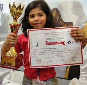 Myrah Suchdev, of Mumbai City proudly poses with her trophy and certificate after winning the Girl’s Under-6 crown in the Maharashtra State Schools Chess Championship 2019.