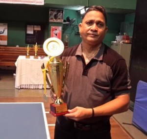 Prakash kelkar displays his huge JVPGC Trophy, at MIG club, which he had won 3 days ago.