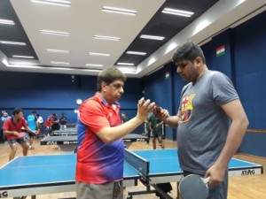 Mihir Tambe of MLWB-NMJ( Right) ) checks the bat of Prakash Punjabi( CCI) before the start of the final position match in MCDTTA 3rd Division TT league.