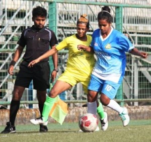  Pacangan FC’s Poonam Mithari (right) shields the ball from Footie First attacker Atisha Saini during their WIFA Women’s Football League .