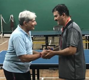 Preemjit Rananavare( Right) receiving his prize from Dr. Kishore Gundecha after the PJ Hindu Gymkhana Home TT Tourney. 