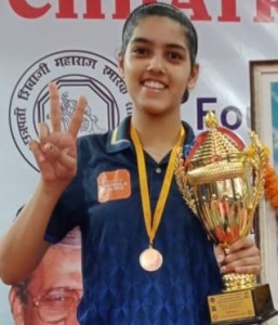 Pritha proudly holds her second trophy 