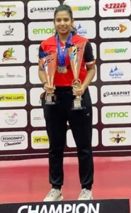 Indian paddler Reeth Tennison who emerged women’s singles champion poses with her trophies.