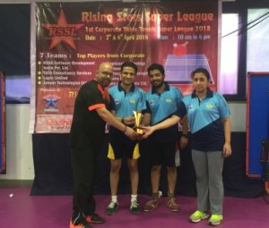 Chief Guest Mr.Rohit Bansal, Assistant Vice President ,( Ext left)  handing over the trophy to Amit Dhekane, Ambrosh kichlu &  Chandrama Ramkumar.