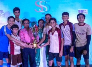 The victorious Children Academy boys are all smiles as they proudly pose with the ‘Champions’ trophy along with Chief Guests Mr & Mrs V.C. Jose at the prize distribution function of the inaugural ‘Savio Super 5s’ hockey tournament . 