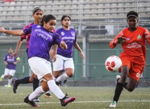 S.P. Football Academy striker Mmehak Lobo (left) shoots at goal past Pacangan FC goalkeeper during their WIFA Women’s Football League played at the Cooperage Football ground.