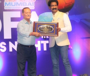 Chief Guest, Ranjit Thapa, a legendary Indian footballer, receives a memento from former Indian goalkeeper Henry Menezes at the MDFA Awards Night function at the Cooperage stadium.