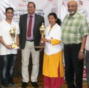 Sangeeta Chandorkar (Reserve Bank of India) and Sandeep Deorukhkar (ONGC) winner of women and men singles crowns respectively proudly hold their ‘Champions’ trophies as they pose with Chief Guest Pratap Mohanty,  Isaac Prasadam, at the prize-distribution function of the 6th Muthoot Finance-Bombay YMCA Mumbai District Ranking Carrom Tournament- 2019.